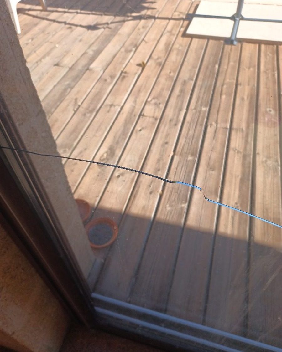 Avant : baie coulissante sur terrasse : vitrage fissuré remplacé